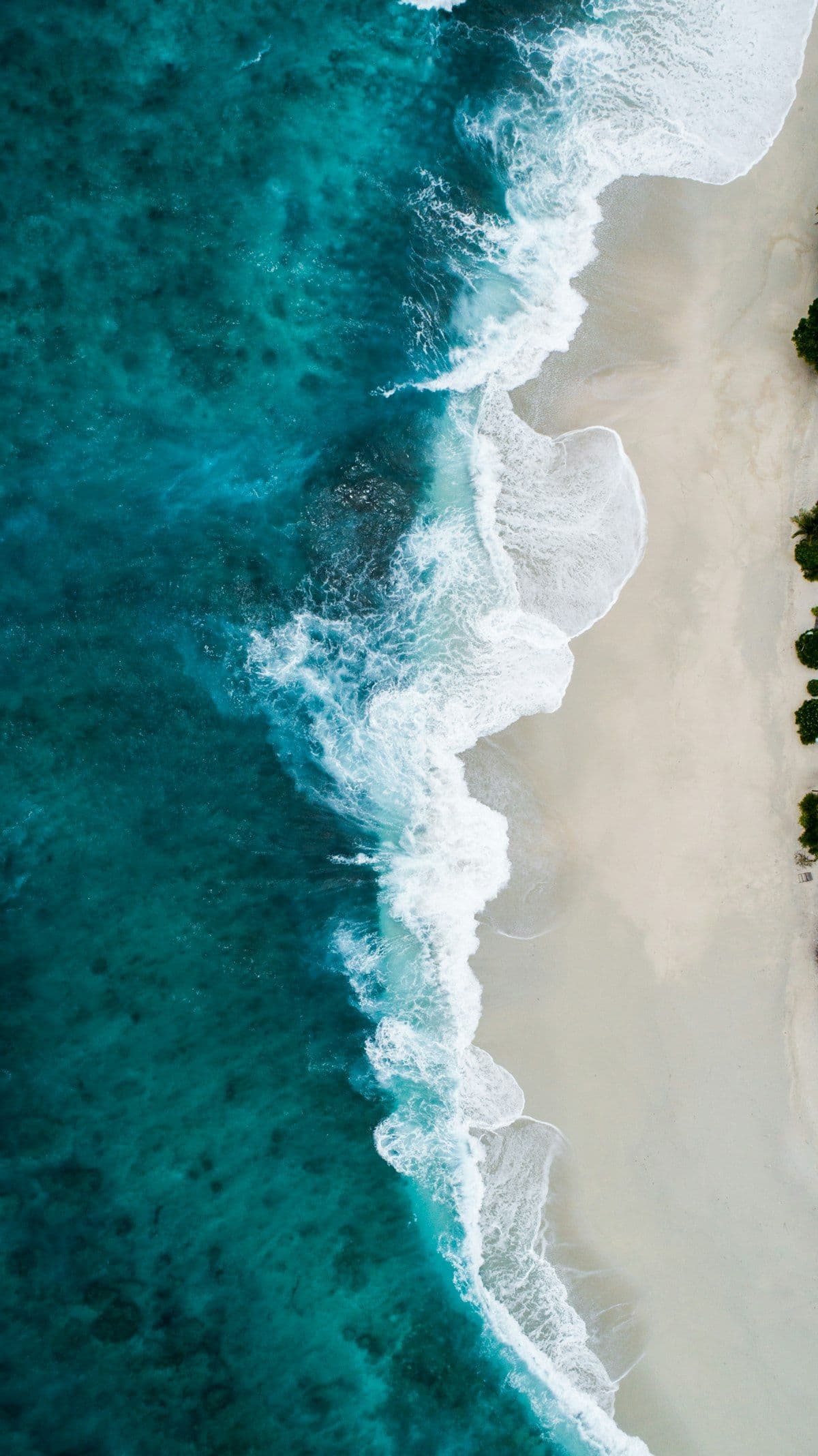 Muted blue-grey coastal water surface and shoreline structure